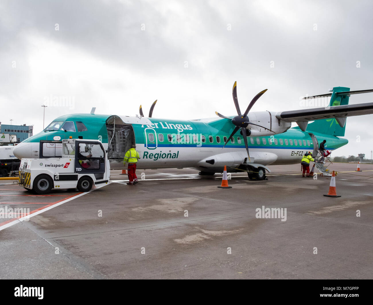 Stobart Air regional Irish airline ATR 72-600 twin propeller aircraft operating Aer Lingus Regional flights being loaded with passengers and baggage Stock Photo