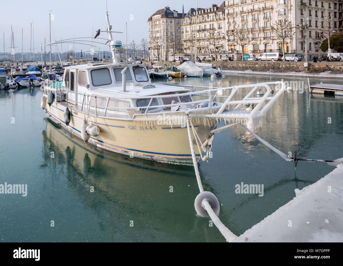 Boats in Geneva covered in ice, Geneva, Switzerland Stock Photo