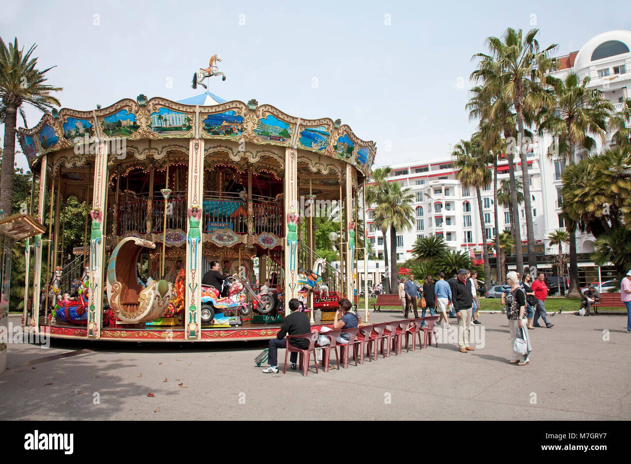 Historical children's merry-go-round at Boulevard La Croisette, Cannes, french riviera, South France, France, Europe Stock Photo