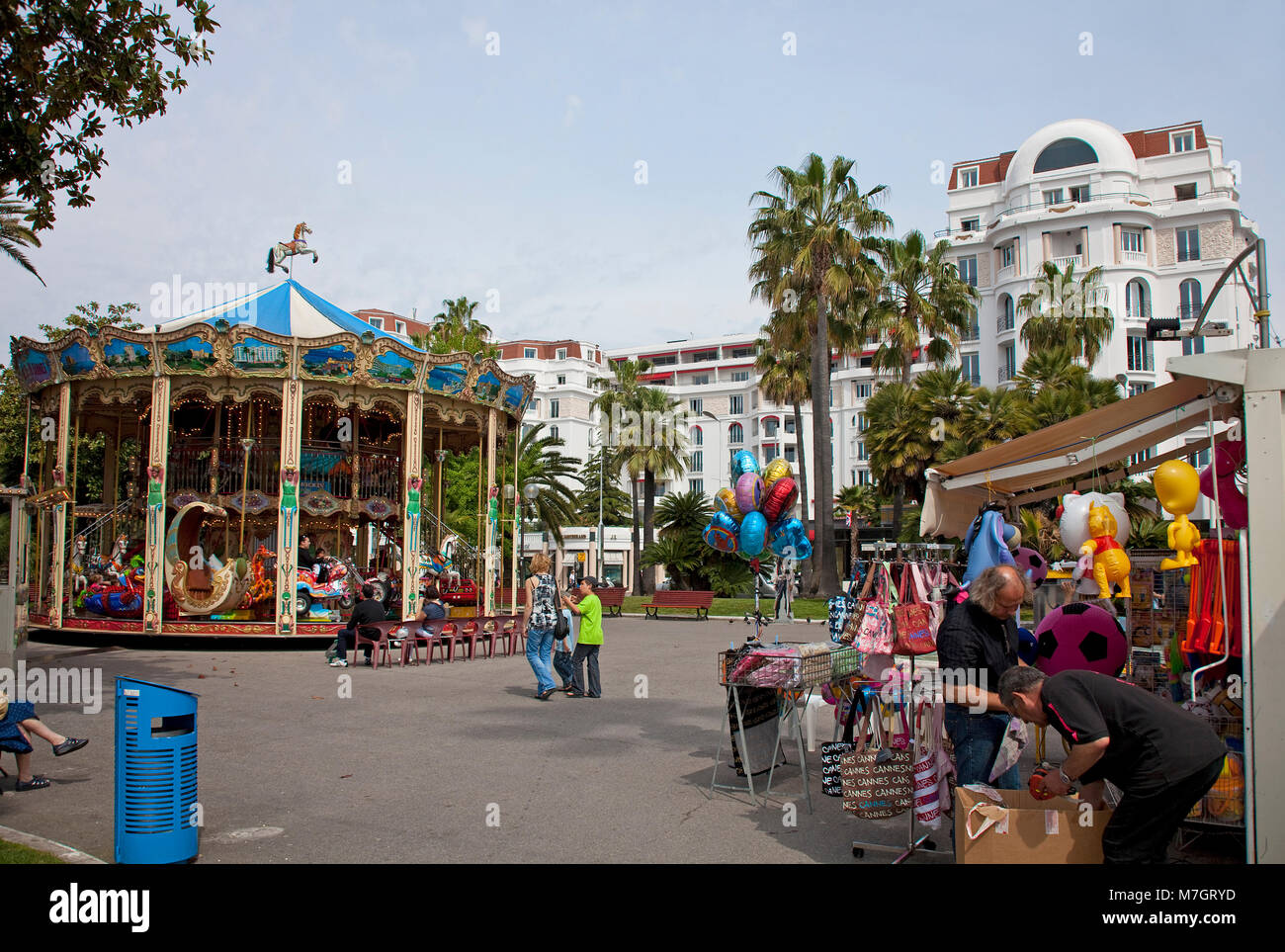 Historical children's merry-go-round at Boulevard La Croisette, Cannes, french riviera, South France, France, Europe Stock Photo