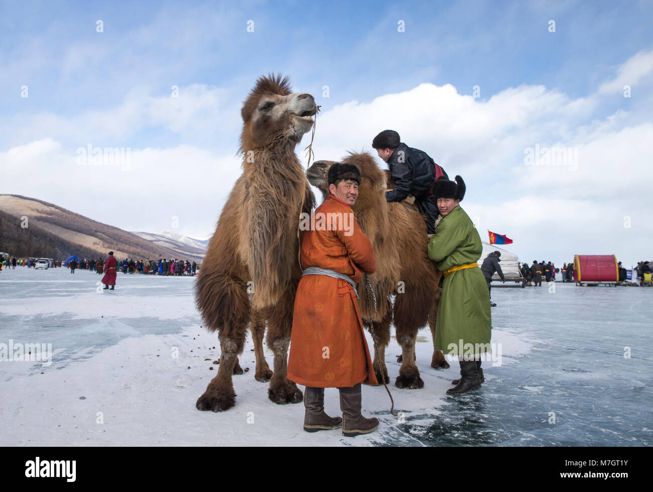 Hatgal, Mongolia, 3rd March 2018: mongolian people on a frozen lake Khuvsgul during a ice festival in winter Stock Photo