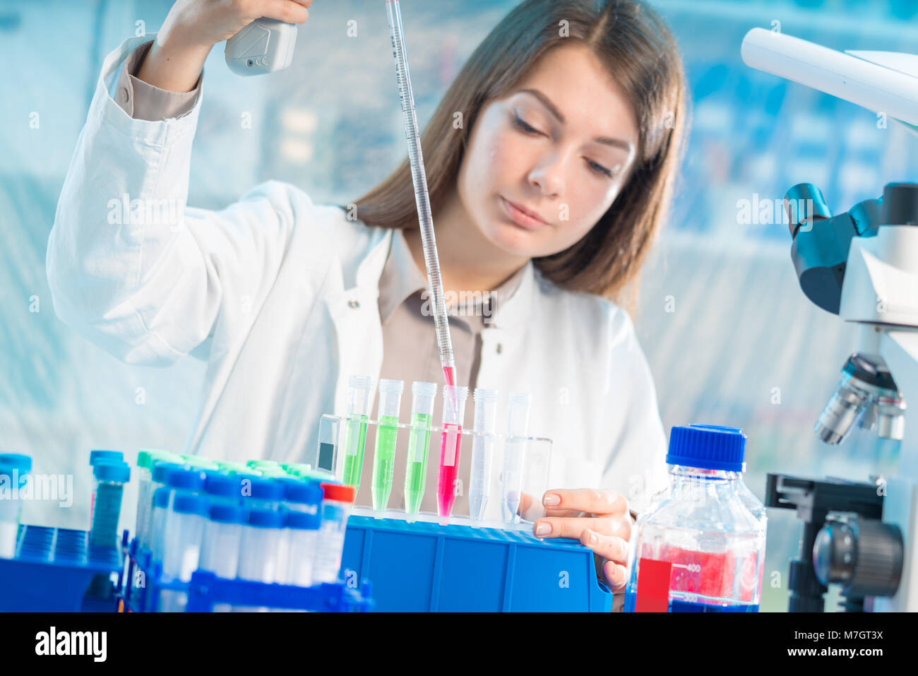 Chemical laboratory scientist woman working with pipette Stock Photo ...