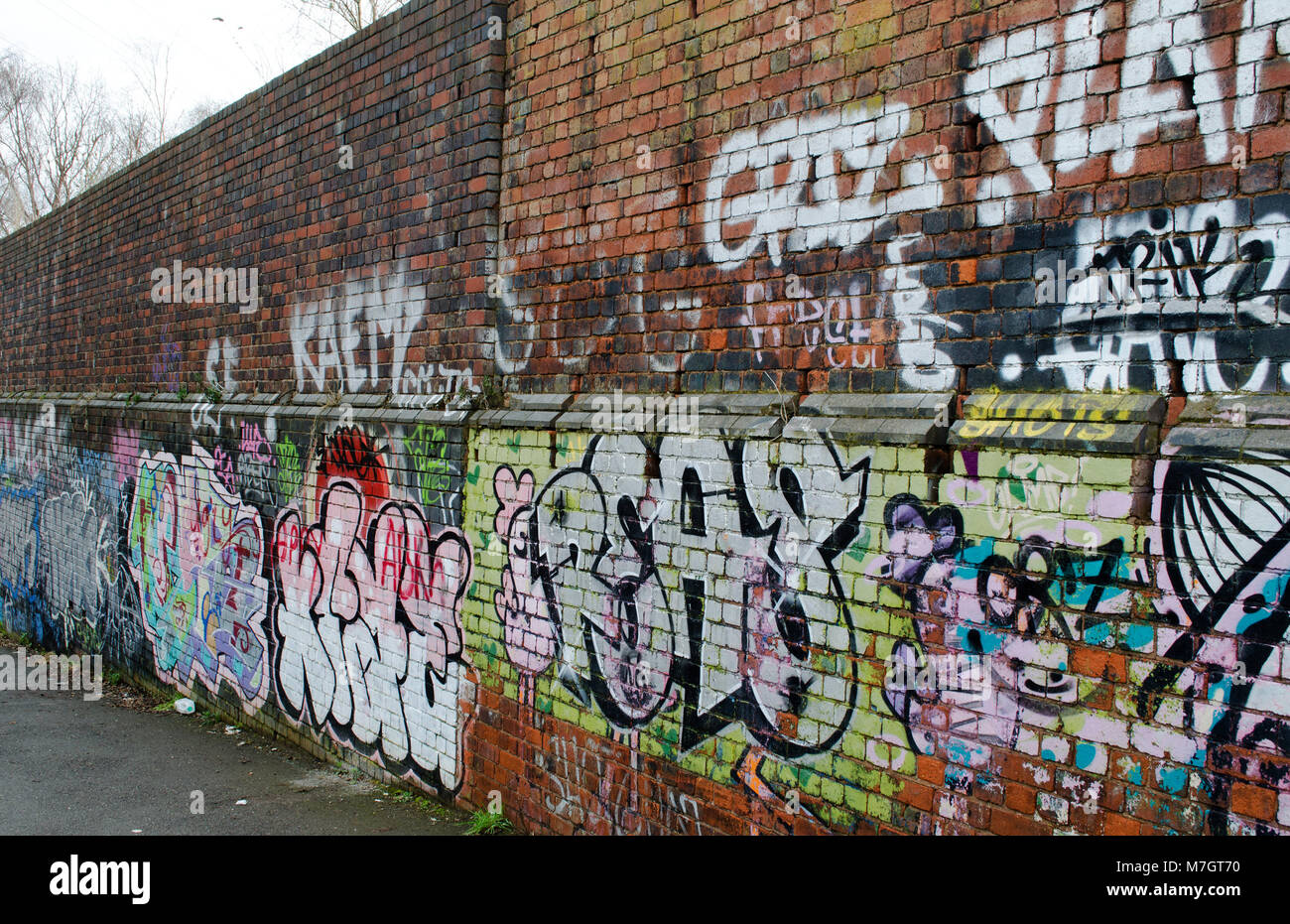 wall graffiti by the canal in Birmingham Stock Photo