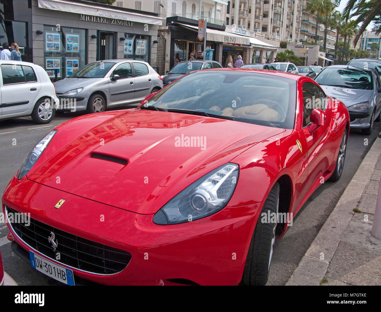Red Ferrari Sport Car at Boulevard La Croisette, Cannes, french riviera, South France, France, Europe Stock Photo