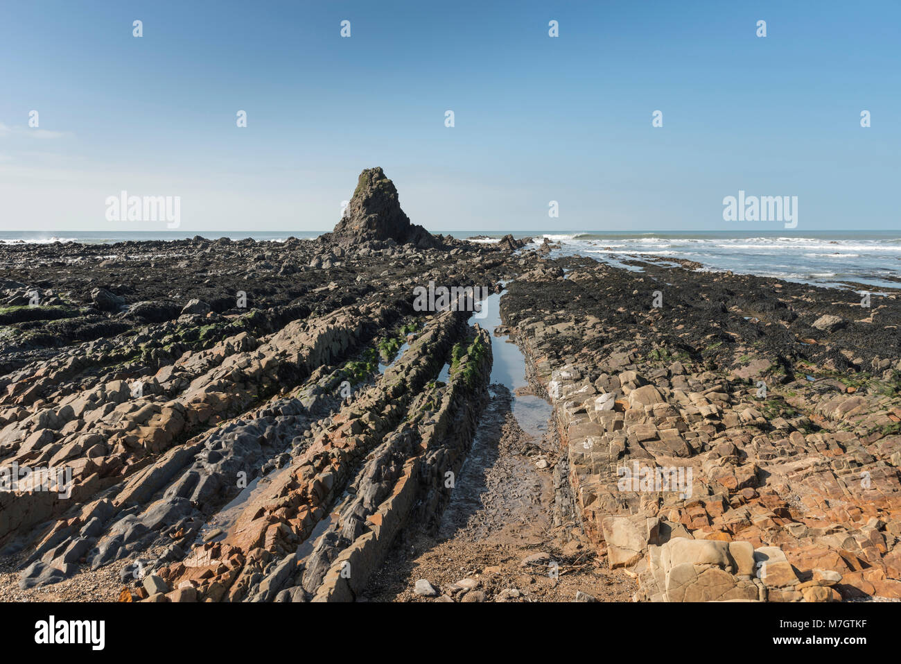 Black Rock and rock formations on beach at Widemouth Bay, North Cornwall Stock Photo