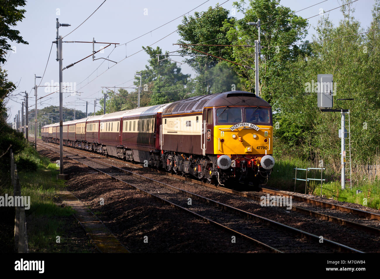 The Belmond Northern Belle luxury dining train heads north on the west coast main line at Bolton Le Sands hauled by a DRS class 47 locomotive Stock Photo