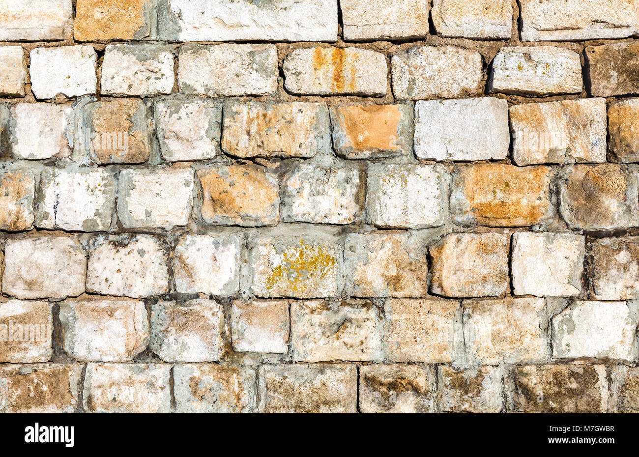 Weathered grey stone wall as background texture Stock Photo - Alamy