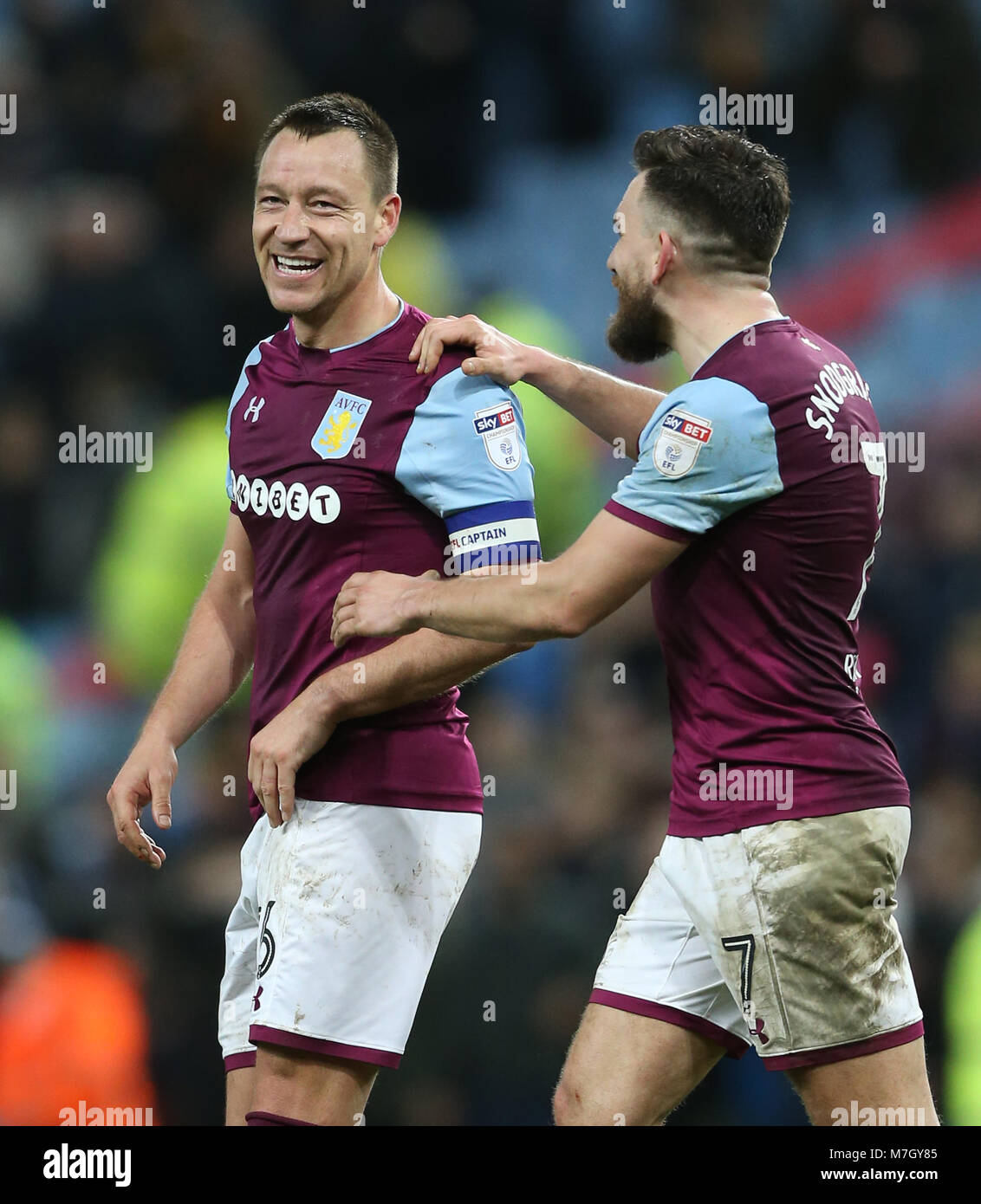 Aston Villa's John Terry (left) and Robert Snodgrass celebrate after the final whistle during the Sky Bet Championship match at Villa Park, Birmingham. Stock Photo
