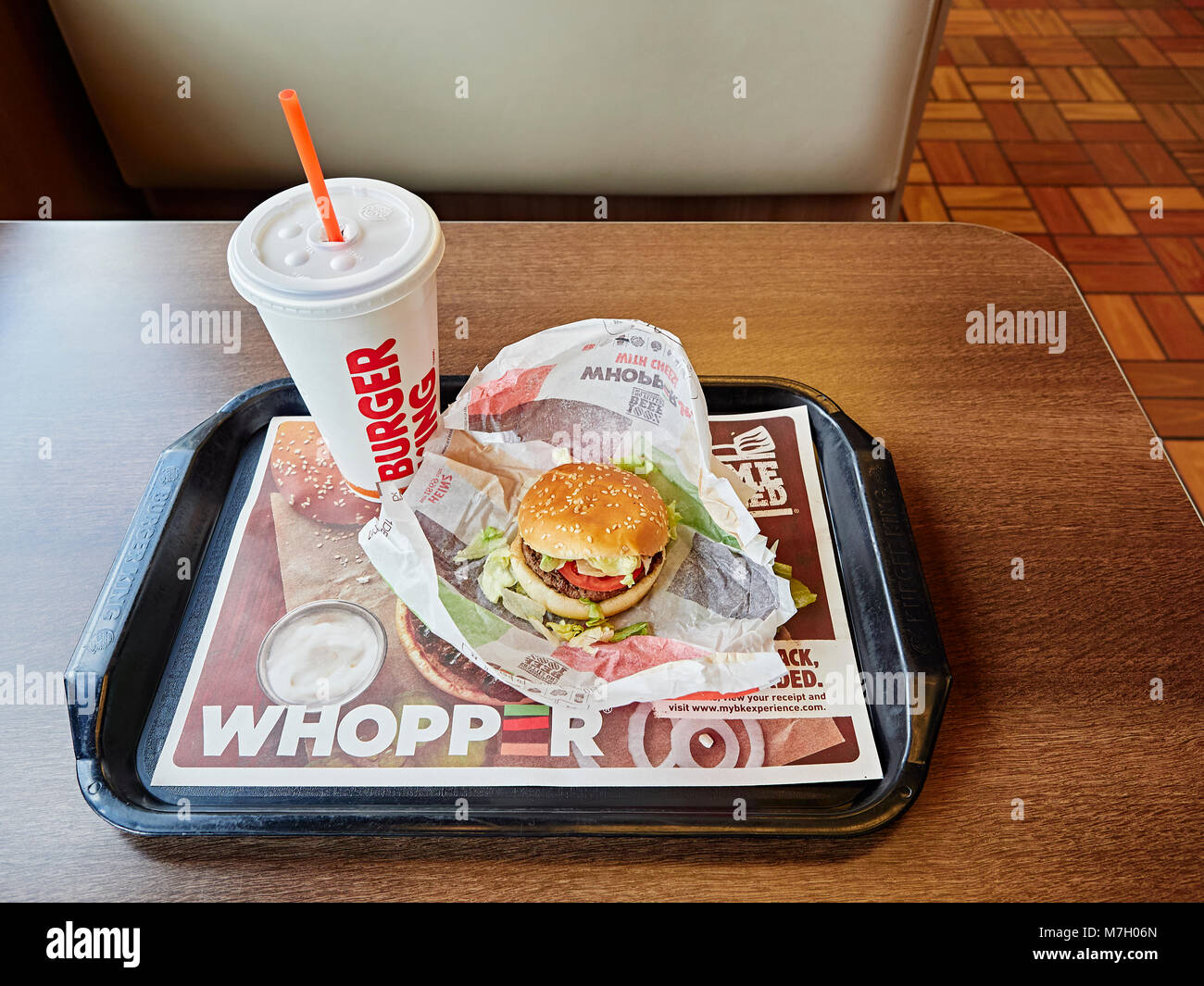 Burger King whopper hamburger and cold drink on the fast food restaurant dinner tray. Stock Photo