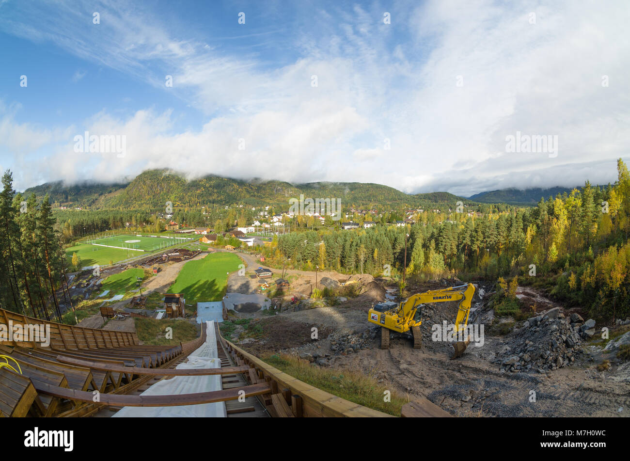 Broad panoramic view of Otra river valley in Evje, with building site of new ski jumping hill in the foreground. Stock Photo