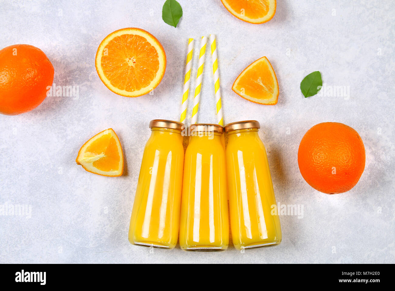 Download Glass Bottles With Fresh Orange Juice With Orange Slices And Yellow Stock Photo Alamy PSD Mockup Templates