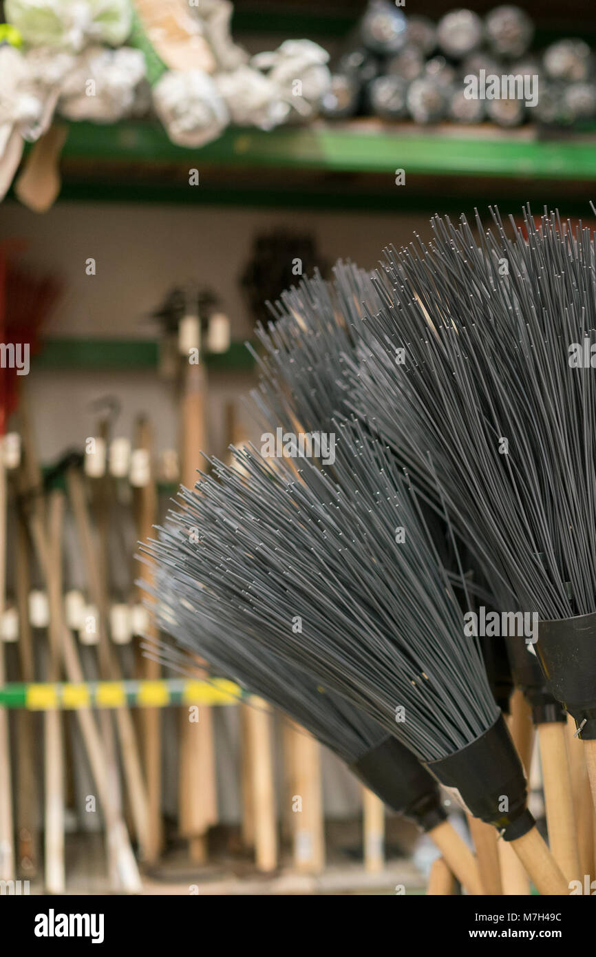 brooms for sale at a hardware store Stock Photo Alamy