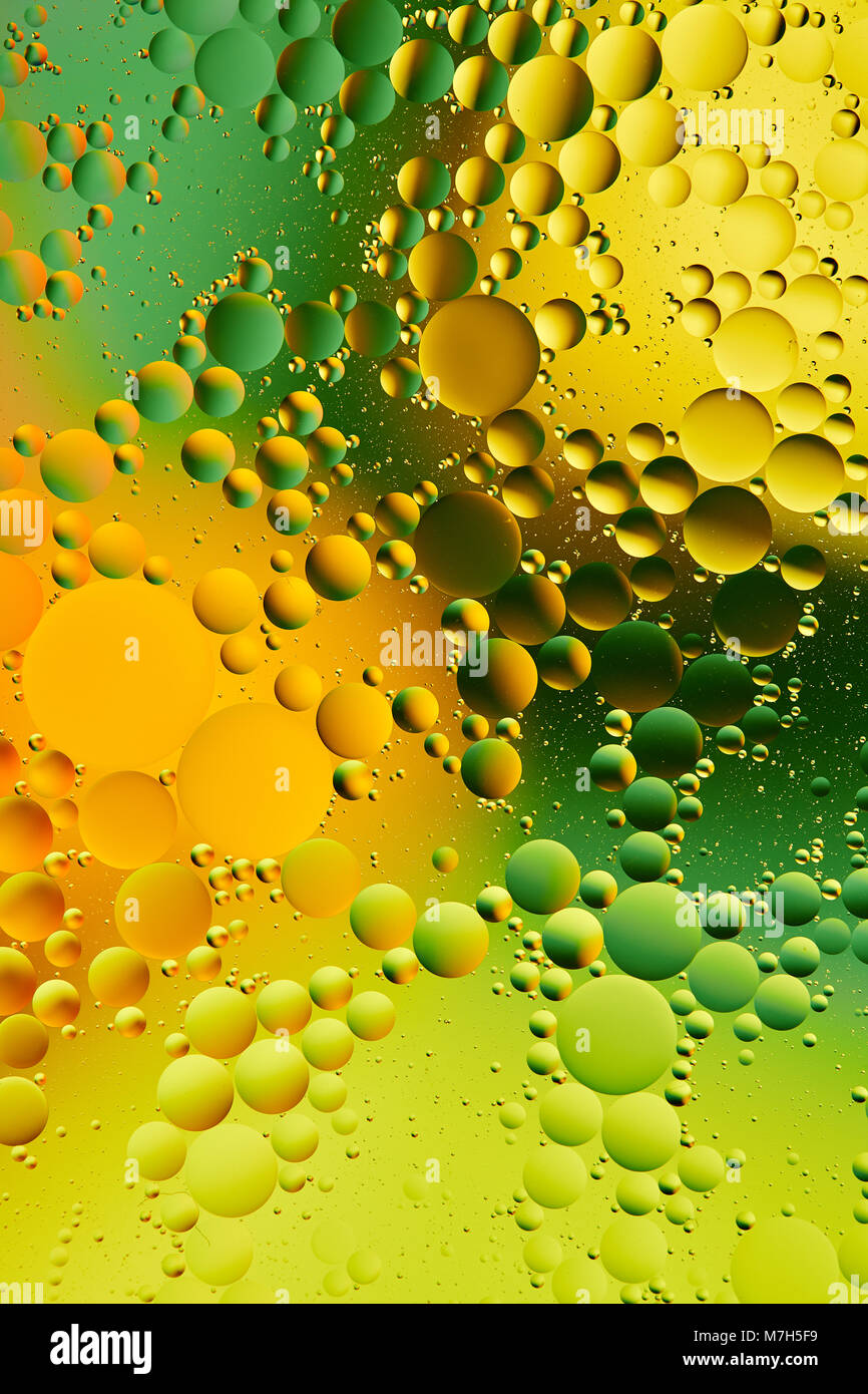 Mixing water and oil, beautiful color abstract background based on red,  green and yellow circles and ovals, macro abstraction. Abstract colorful  backg Stock Photo - Alamy