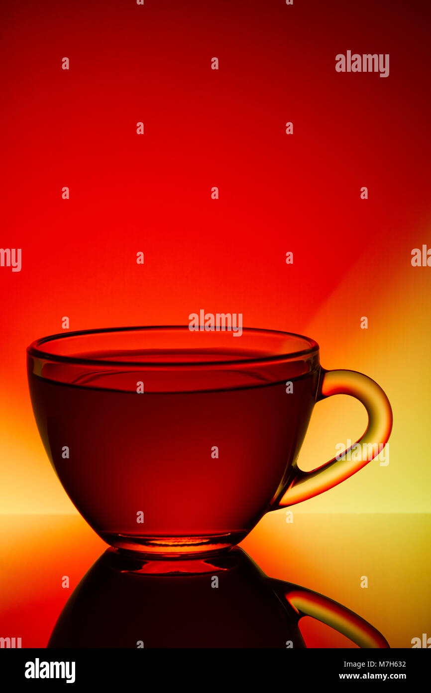 Download Glass Transparent Empty Teacup On A Red And Yellow Background Stock Photo Alamy Yellowimages Mockups