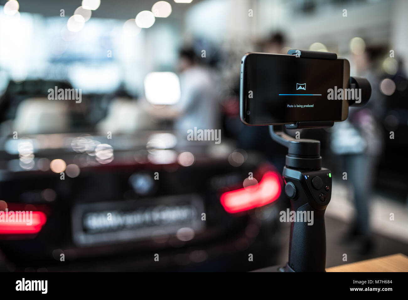 Gimbal camera in action with sport car in background Stock Photo Alamy