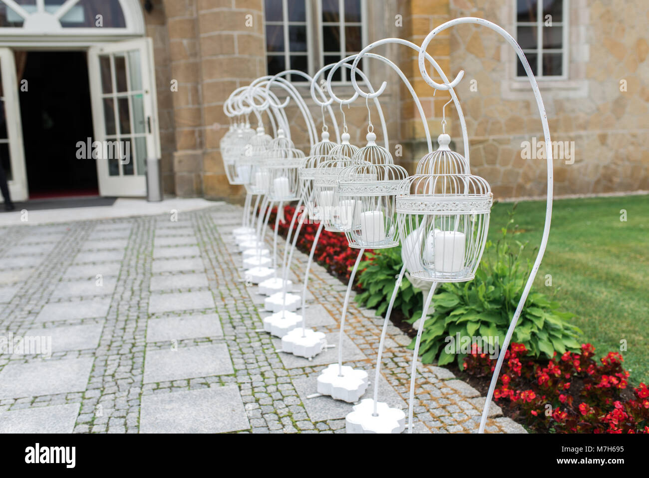 Wedding Garden Candlesticks standing in front of the entrance to the