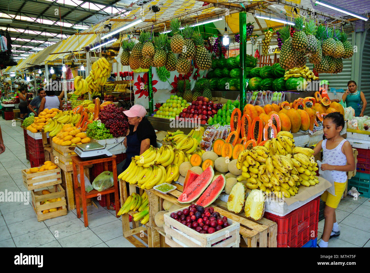 Mexican seller of fruits stand at a local market, Merida, Yucatan, Mexico Stock Photo