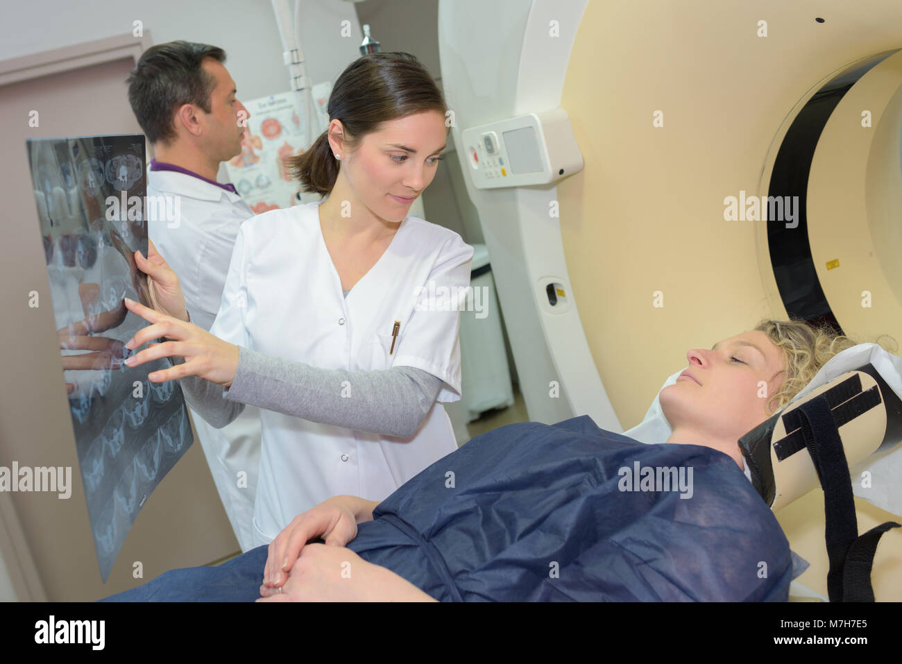 female doctor showing mri patient results Stock Photo