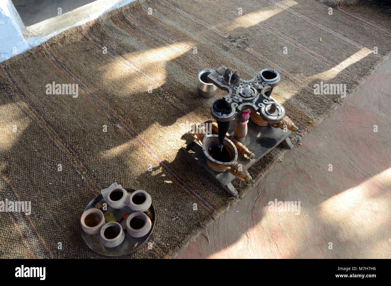 Old antique equipment for the Traditional Opium ceremony Bishnoi village Jodhpur Rajasthen india Stock Photo