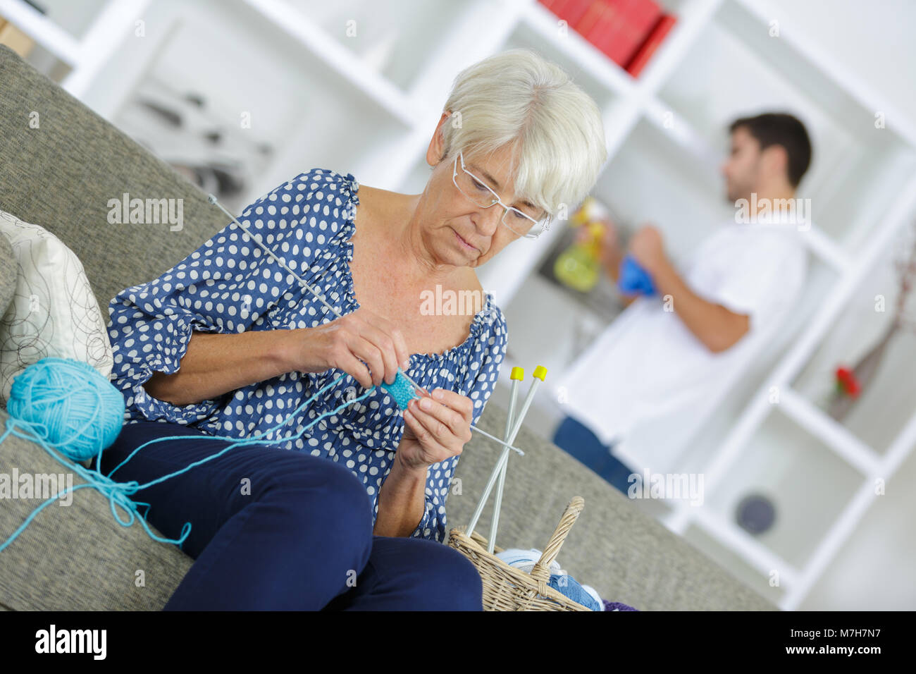 old woman knitting by the window Stock Photo Alamy