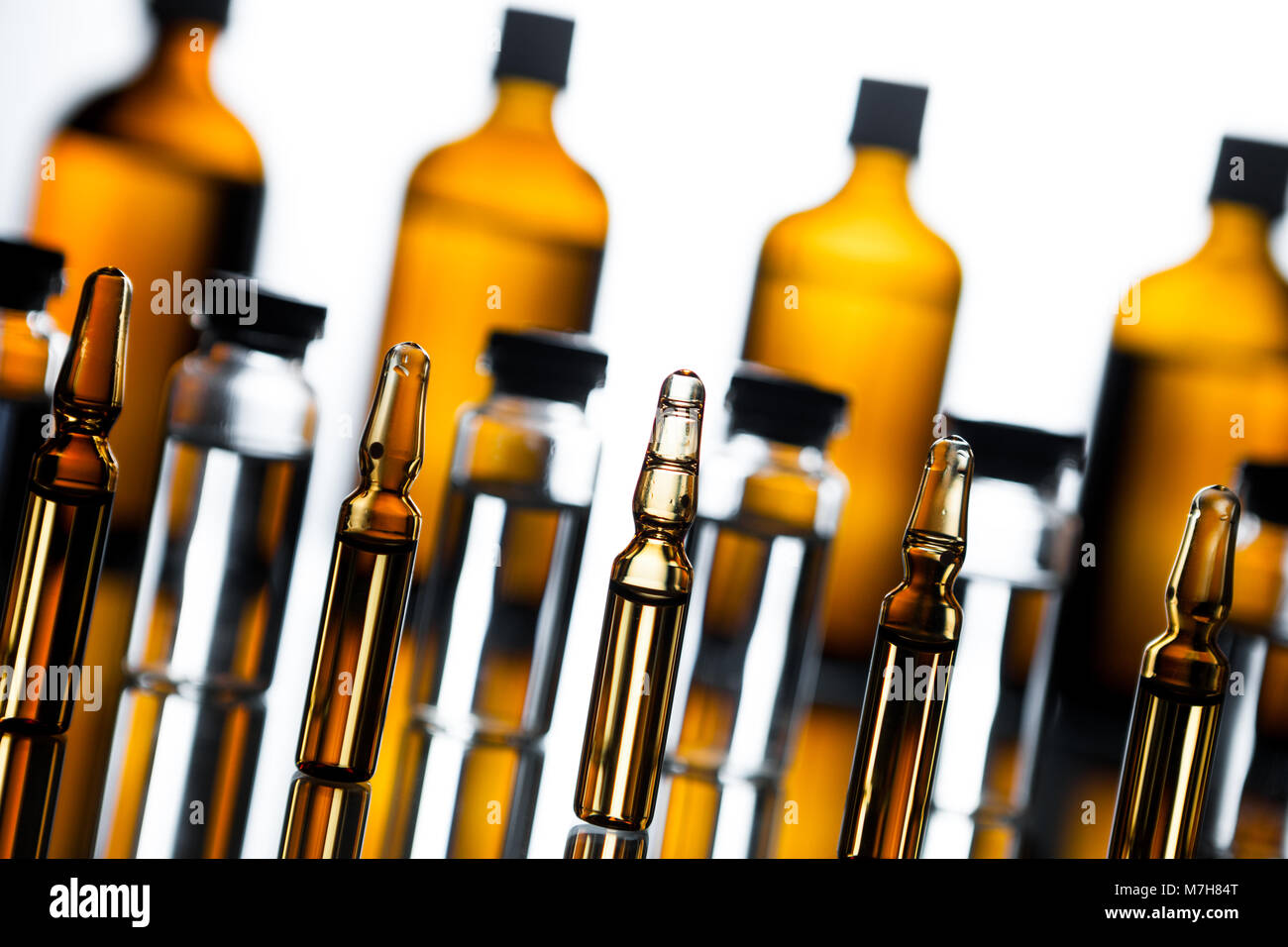 Group of ampoules with a transparent medicine in medical laboratory