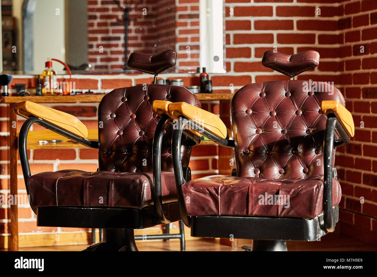 Barber shop, hairdresser chairs made from brown leather. Retro leather