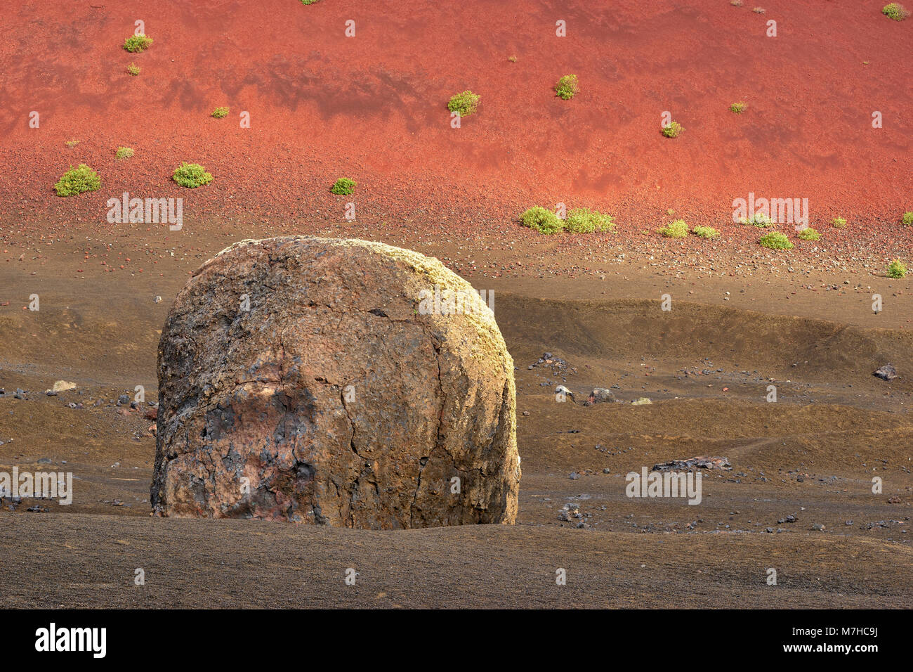 The worlds largest volcanic bomb and Caldera Colorada, Lanzarote, Canary Islands, Spain Stock Photo