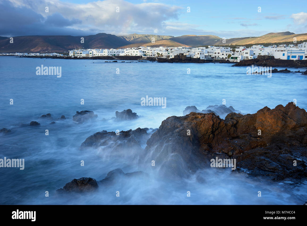 Village of Punte Mujeres on the coast of Lanzarote, Canary Islands, Spain.  Long exposure Stock Photo
