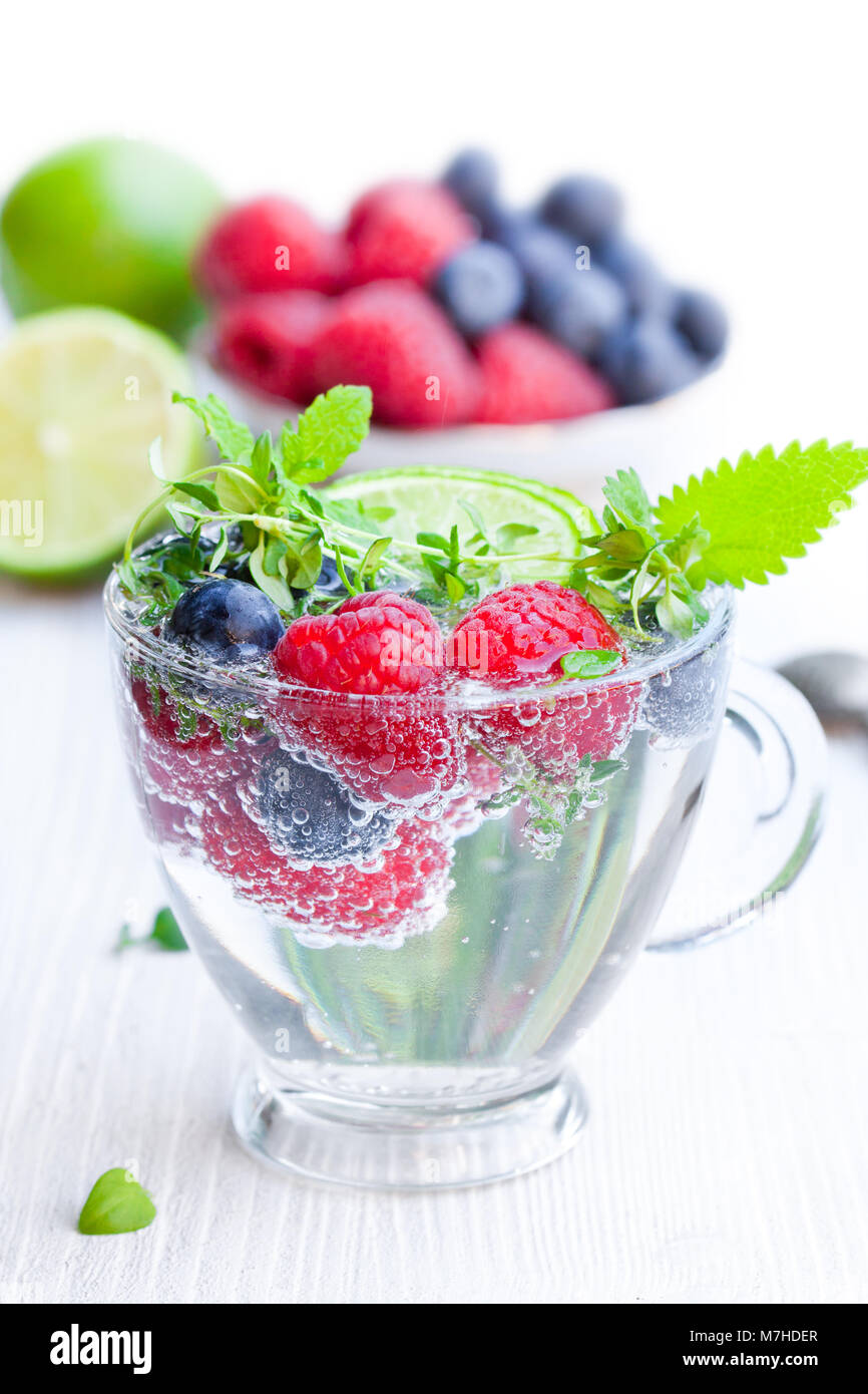 Detox water. Homemade summer fruit drink with raspberry and blueberry