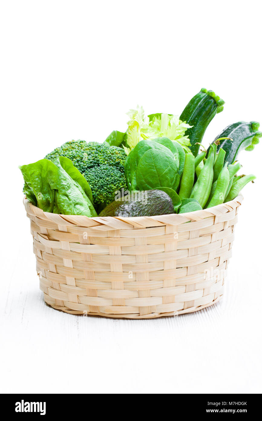 Fresh green vegetables in wicker basket Stock Photo - Alamy