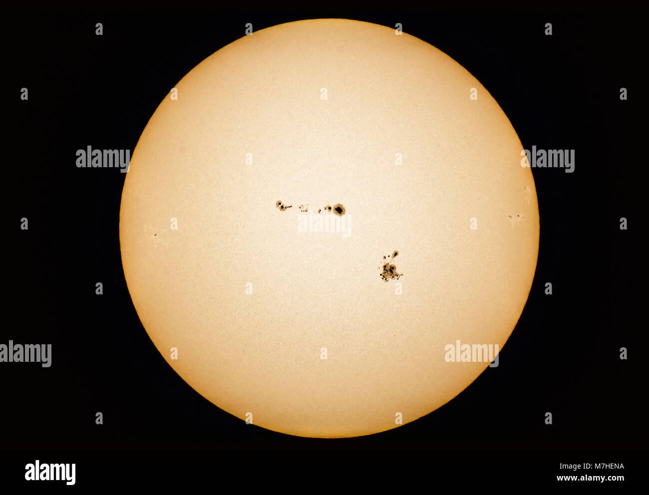Particularly large groups of sunspots on the Sun. Stock Photo