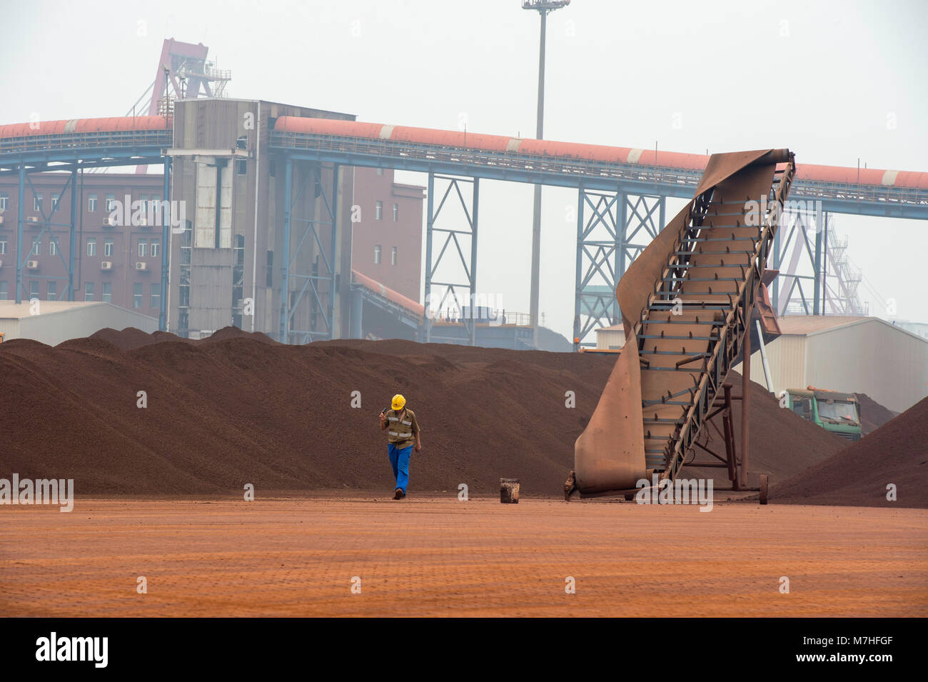 Iron Ore stockpile storage on the docks in Tianjin Port China Stock