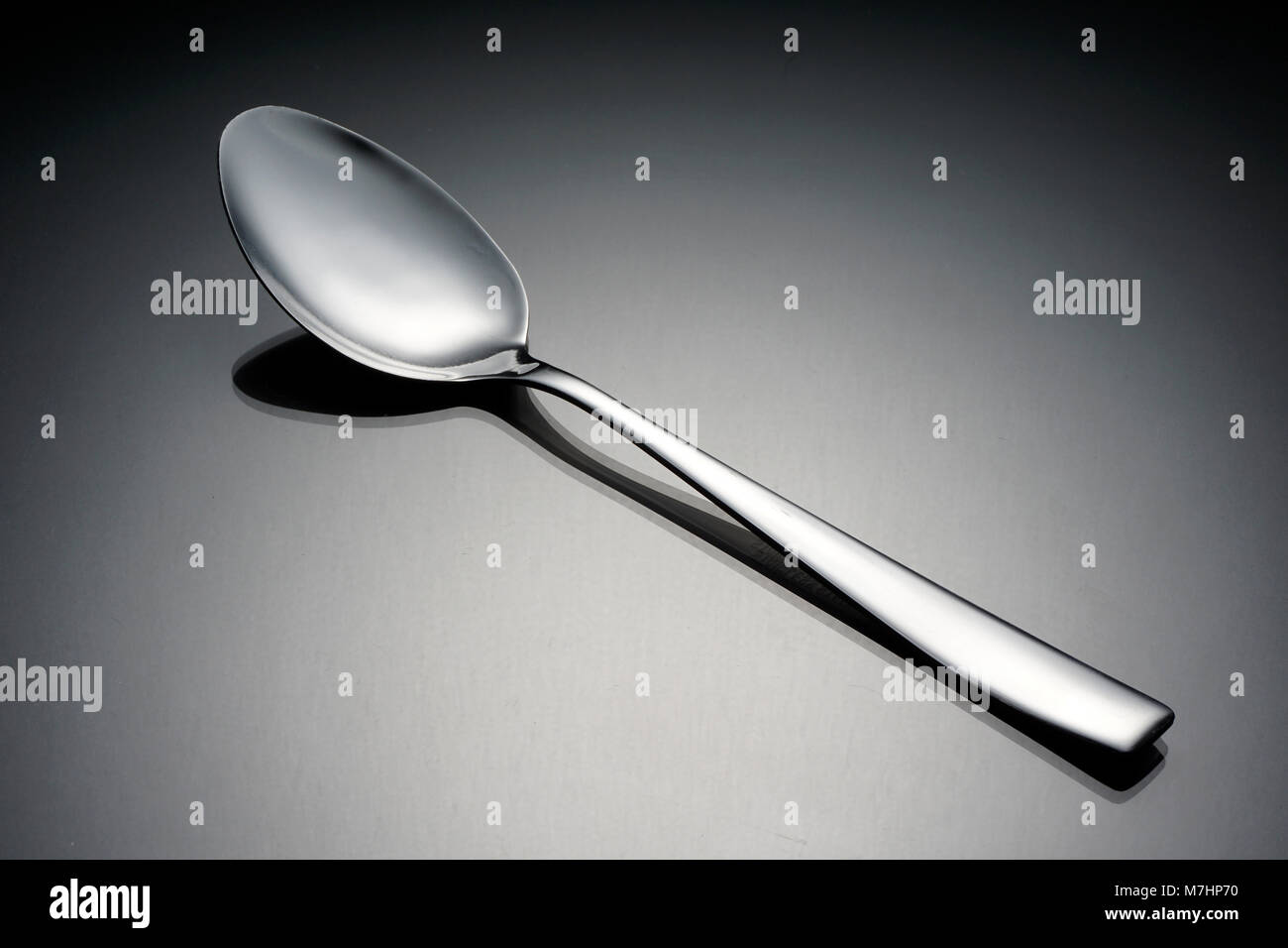 Cutlery concept over black background. Still life image of fork, spoon