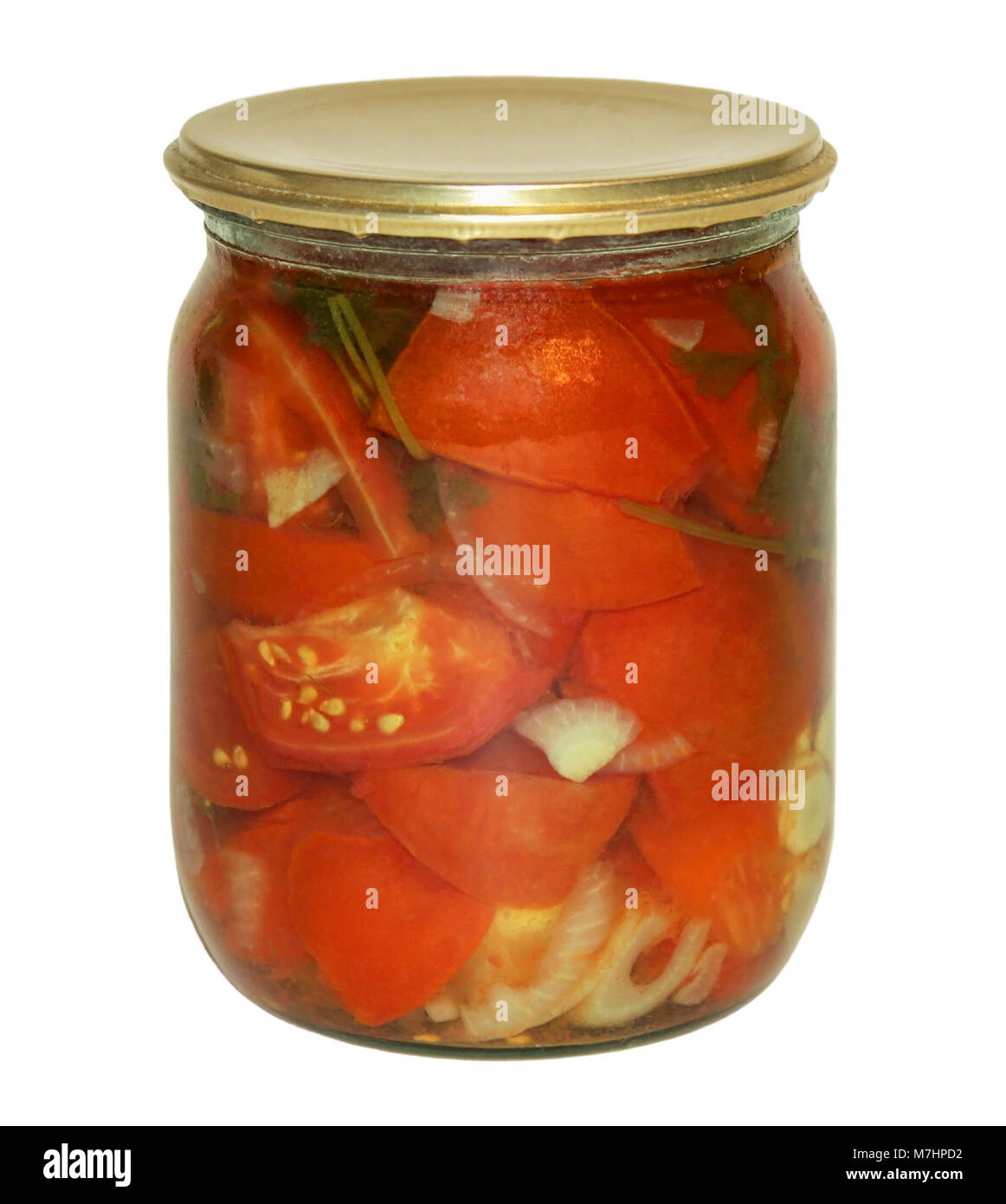 Marinated tomatoes, rolled in a glass jar on white background. Stock Photo