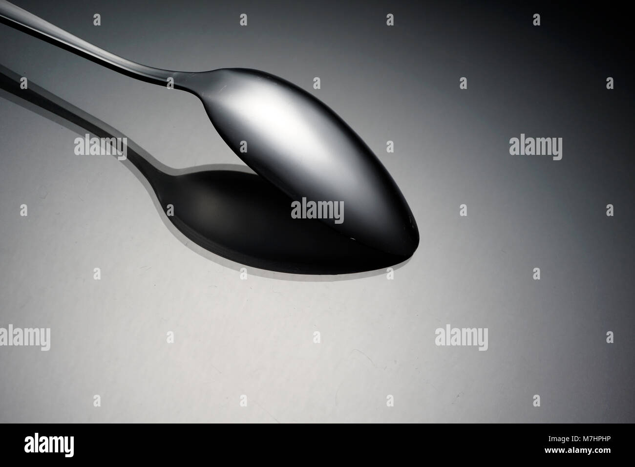 Cutlery concept over black background. Still life image of fork, spoon