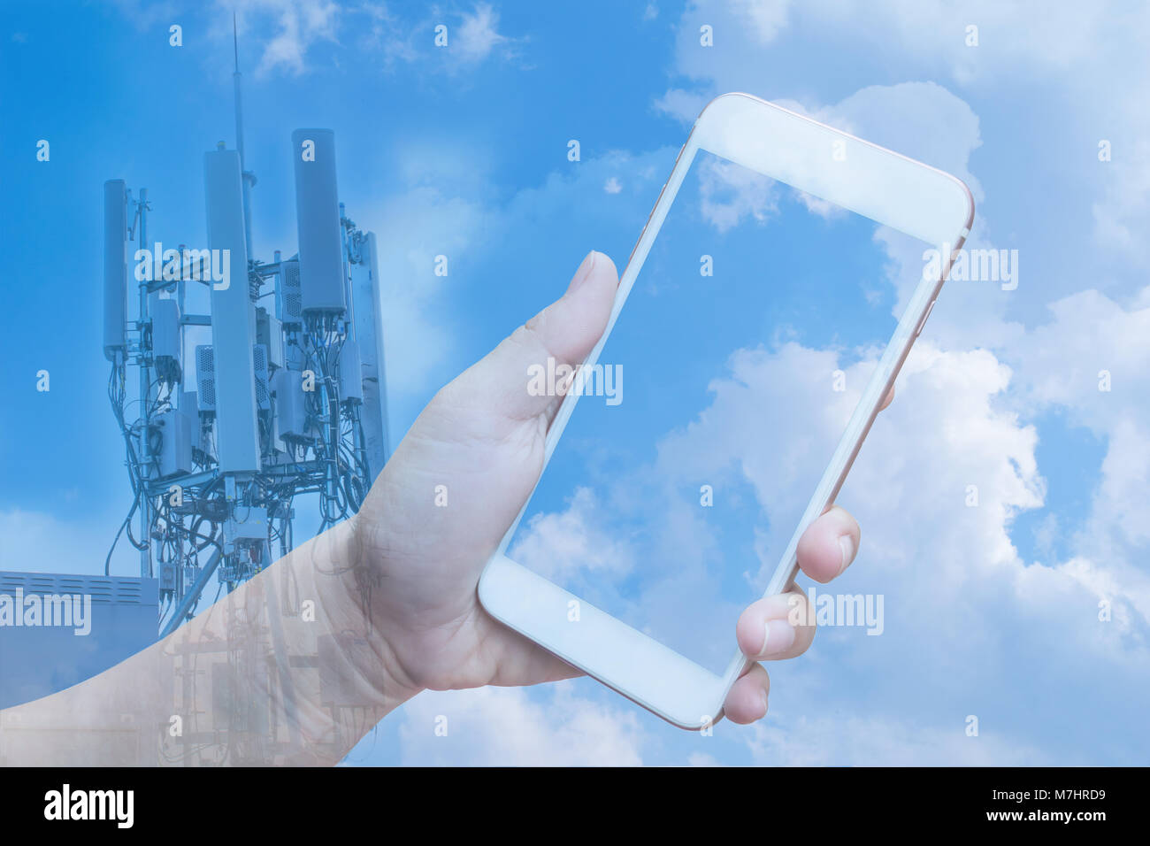 Double exposure with hand holding smartphone and telecommunications ...