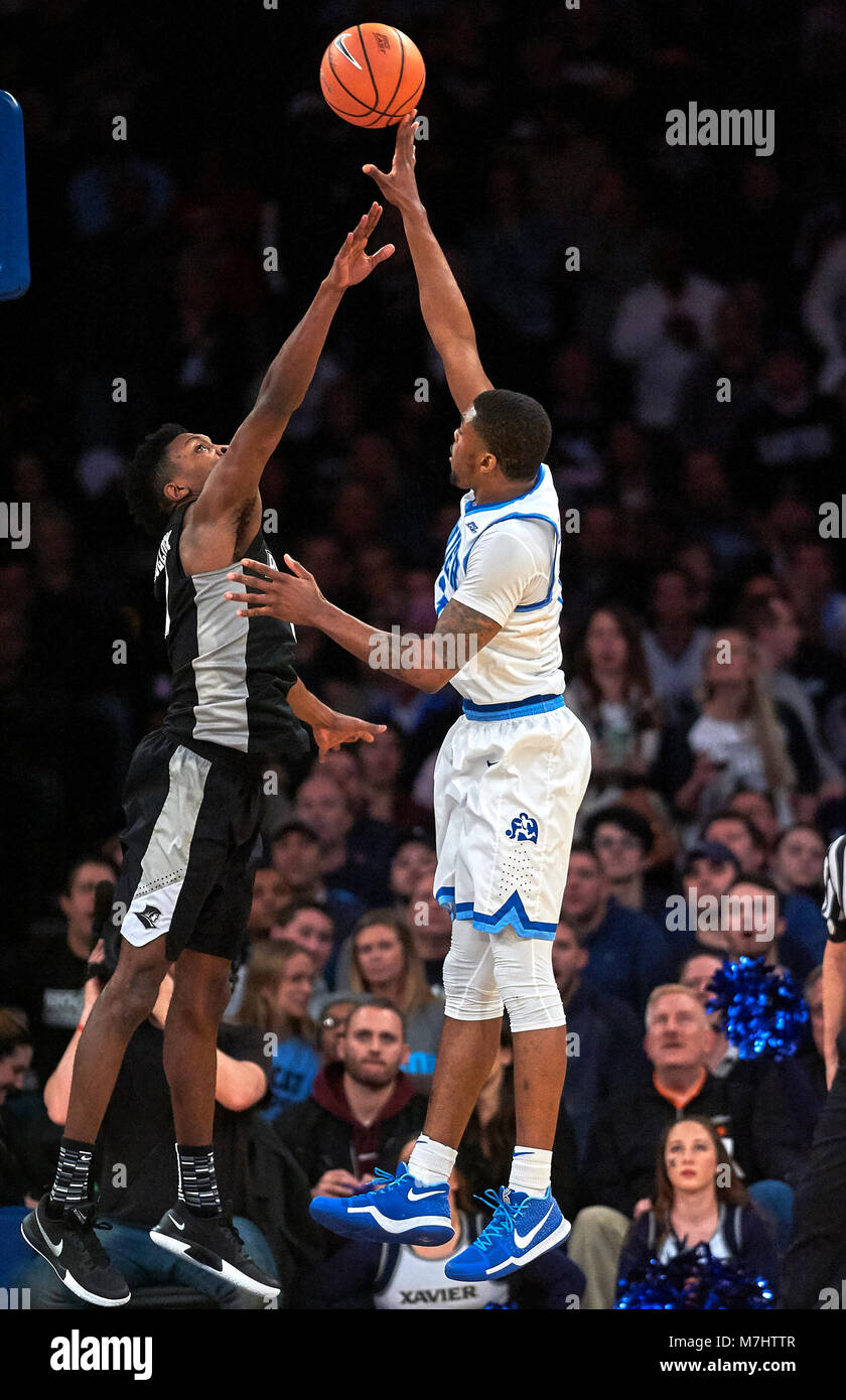 New York, New York, USA. 9th Mar, 2018. Xavier Musketeers forward Tyrique Jones (0) shoots against Providence Friars forward Rodney Bullock (5) in the second half of semifinals during the Big East Conference Tournament at Madison Square Garden in New York City. Providence defeats Xavier in overtime 75-72. Duncan Williams/CSM/Alamy Live News Stock Photo