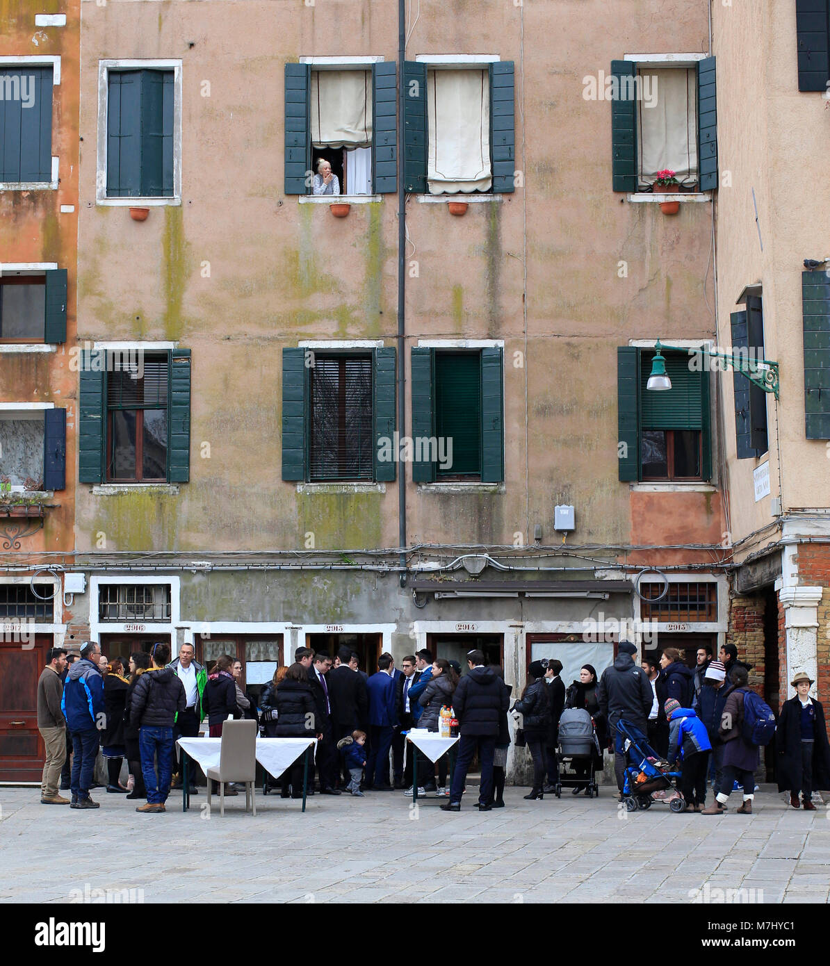 Venice, Italy. 10th, Mar 2018.  Members of Jewish Community in the Campo del Getto Nuovo, during the Shabbat celebrations, day of the Israel community festivities in Venice.The Campo del Ghetto Nuovo is located in Venice in the Cannaregio district. The Campo del Ghetto Nuovo is the true center of the Jewish Ghetto of Venice. This ghetto was the first in the world and took its name from an existing foundry where they melted or 'threw' the metals needed for naval construction in the Arsenal. Hence the name 'jet' and therefore 'ghetto', in which everyone now recognizes a place of segregation.The  Stock Photo