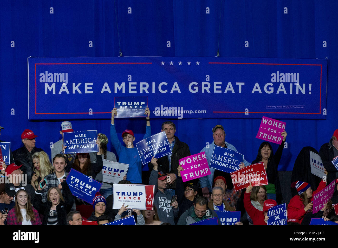 Supporters hold campaign signs during a Make American Great Rally at Atlantic Aviation in Moon Township, Pennsylvania on March 10th, 2018. Credit: Alex Edelman/CNP /MediaPunch Stock Photo