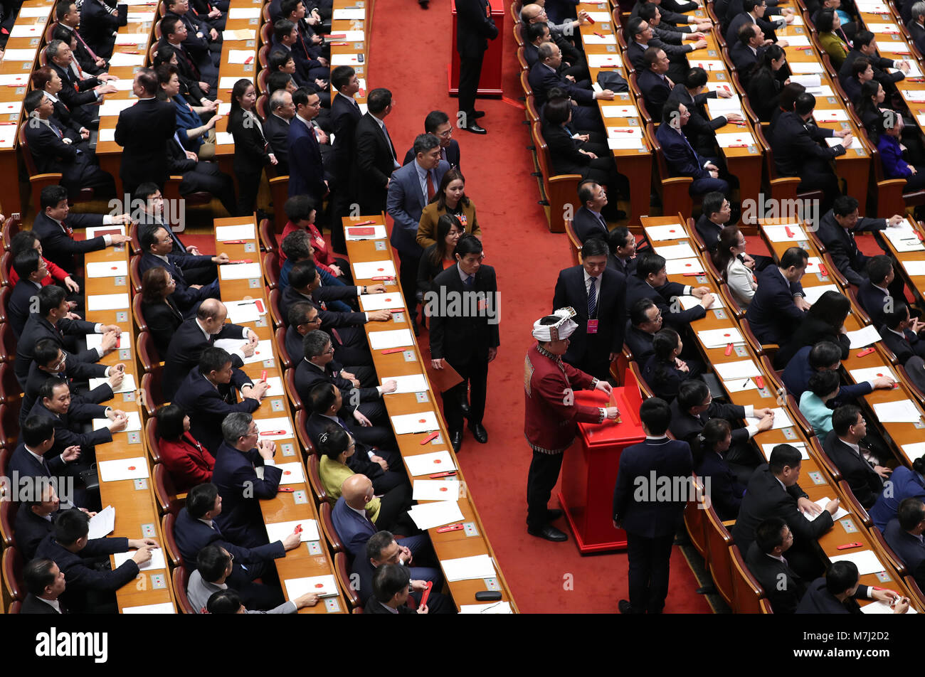 Beijing, China. 11th Mar, 2018. Deputies to the 13th National People's Congress (NPC) cast their ballots on a draft amendment to the country's Constitution at the third plenary meeting of the first session of the 13th NPC in Beijing, capital of China, March 11, 2018. Credit: Ding Haitao/Xinhua/Alamy Live News Stock Photo