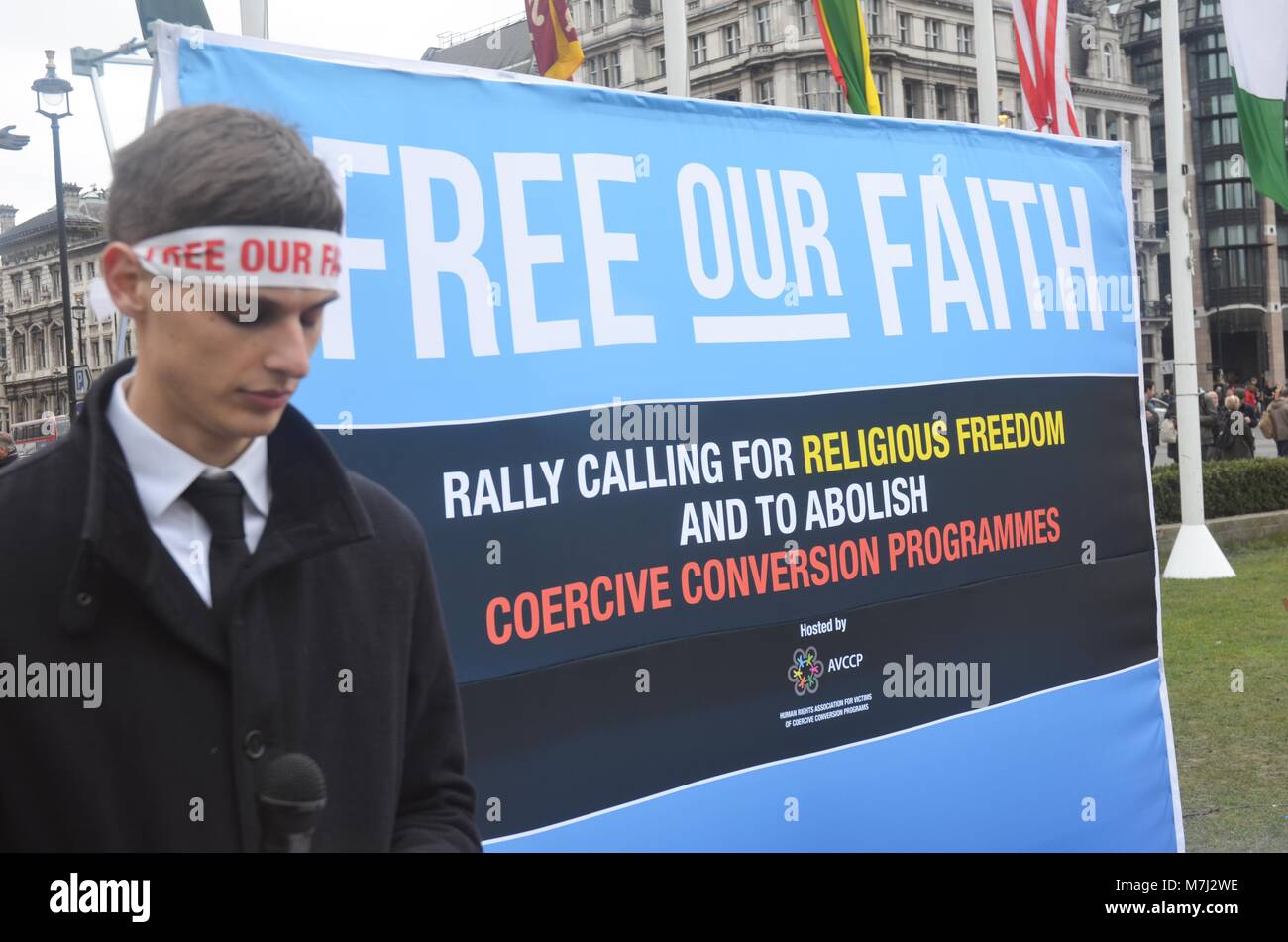 Parliament Square, London, UK. 11th March, 2018. inter religious faiths gathered to pay respects to those murdered in conversion therapy sessions , religious intolerance among the wider world mainstream religions.  conversion often entails   violent and damaging forms of persecution and cohesion programming.  a silent vigil took place on Parliament square to highlight both the practice and victims . Credit: Philip Robins/Alamy Live News Stock Photo