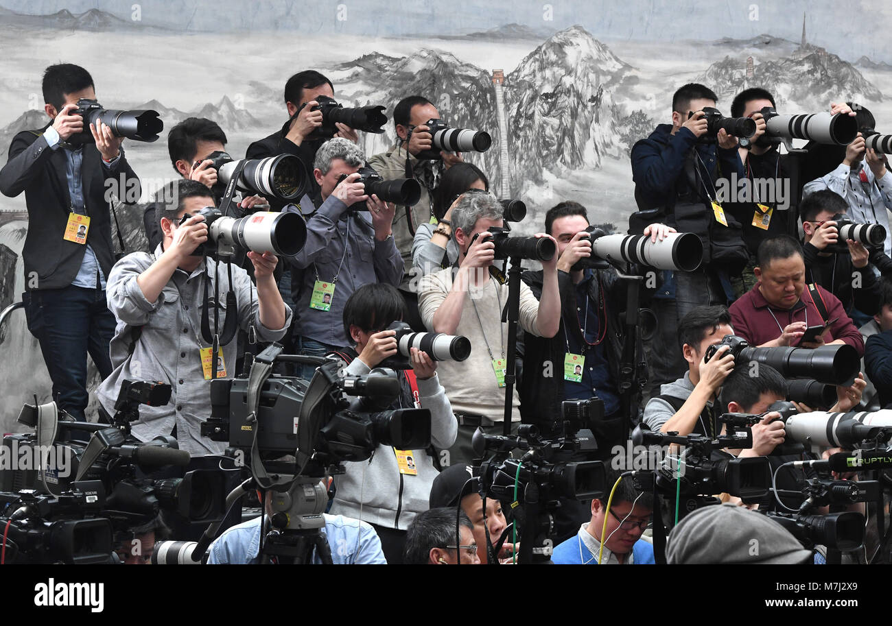 Beijing, China. 11th Mar, 2018. Journalists work at a press conference on an amendment to the country's Constitution on the sidelines of the first session of the 13th National People's Congress in Beijing, capital of China, March 11, 2018. Credit: Shen Hong/Xinhua/Alamy Live News Stock Photo