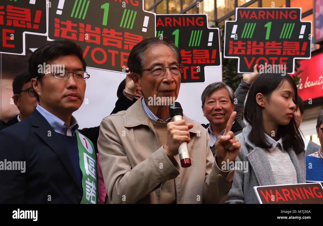 Hong Kong, CHINA. 11th Mar, 2018. Former Chairman of the DEMOCRATIC PARTY and the prominent pro-democracy political leader, Martin Lee ( C ) show up to support candidate No.1 representing Democratic Party, Au Nok-hin ( L ) during last-run campaign in the LEGICO By-Election 2018. Mar-11, 2018 Hong Kong.ZUMA/Liau Chung Ren Credit: Liau Chung Ren/ZUMA Wire/Alamy Live News Stock Photo