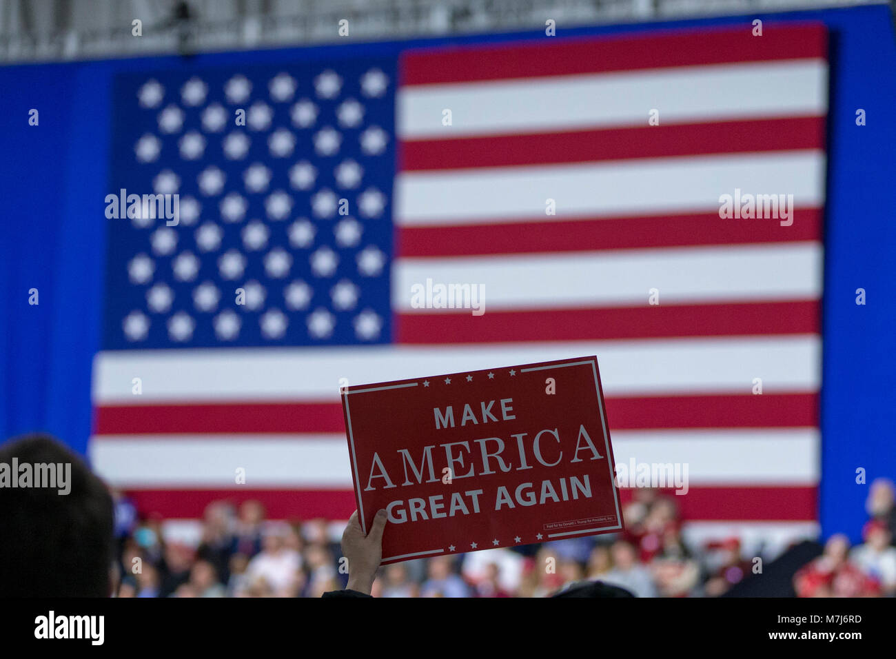 A supporter holds a campaign sign as United States President Donald J ...