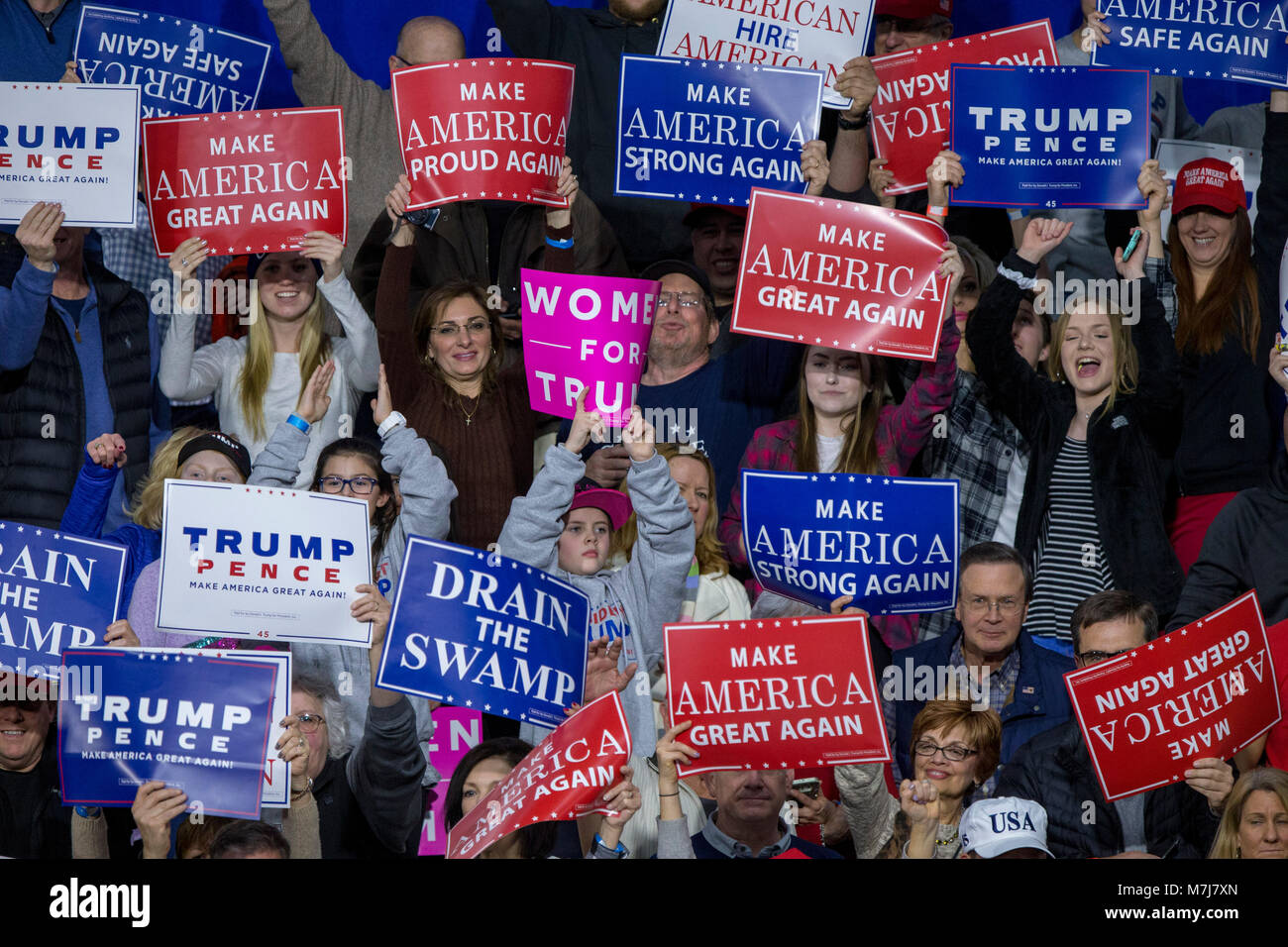 Moon Township, USA. 10th Mar, 2018. Supporters hold campaign signs during a Make American Great Rally at Atlantic Aviation in Moon Township, Pennsylvania on March 10th, 2018. Credit: Alex Edelman/CNP · NO WIRE SERVICE · Credit: Alex Edelman/Consolidated/dpa/Alamy Live News Stock Photo