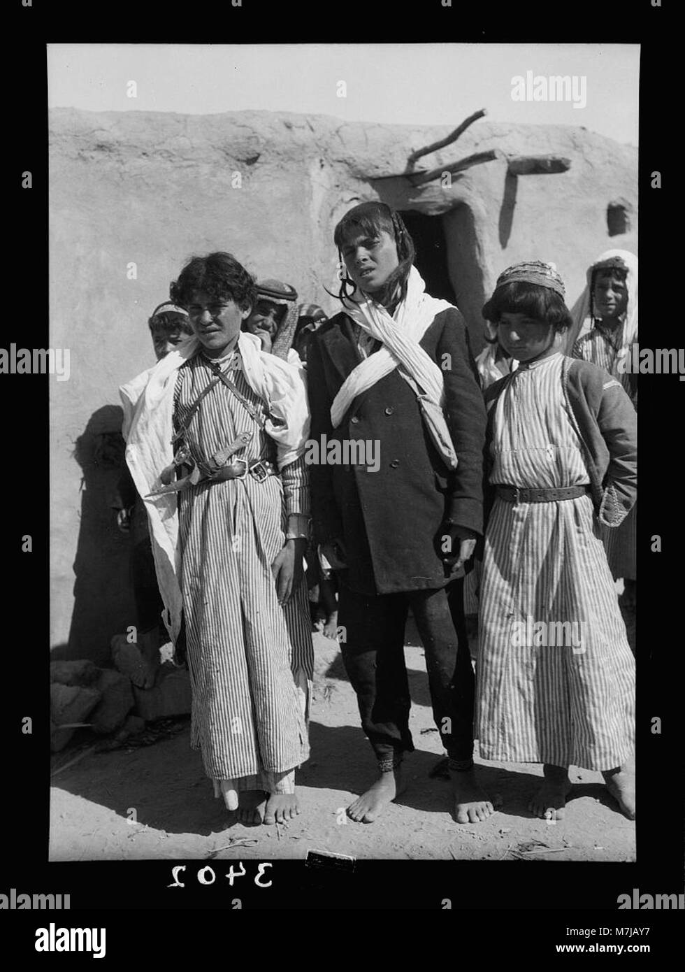 El-Azrak & Wadi Sirhan in the Arabian Desert. Druse (i.e., Druze) political refugees from Jebel Druse (The Hauran). Group of Druse boys. Generation growing up in the desert LOC matpc.15321 Stock Photo