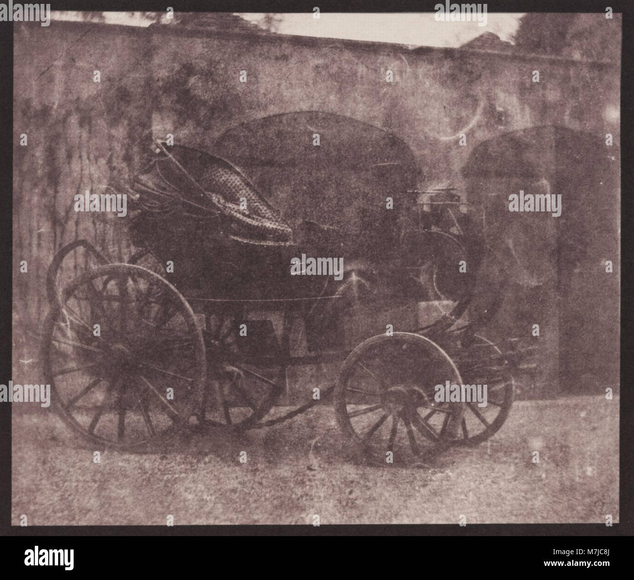 Photograph by William Henry Fox Talbot of a carriage in the courtyard ...