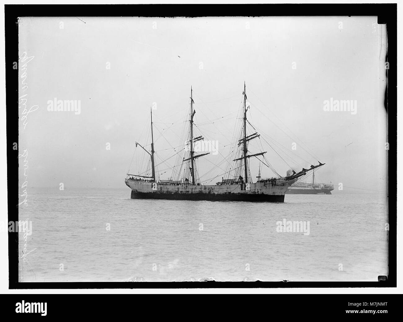 A photograph of a Swedish tramp ship, a type of merchant ship, with square rigging, a prominent vessel design in the 19th and early 20th centuries. Stock Photo