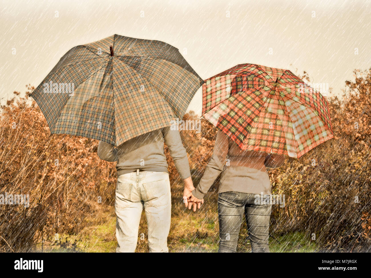 Young couple under an umbrella on the autumn rain.Autumn set Stock ...