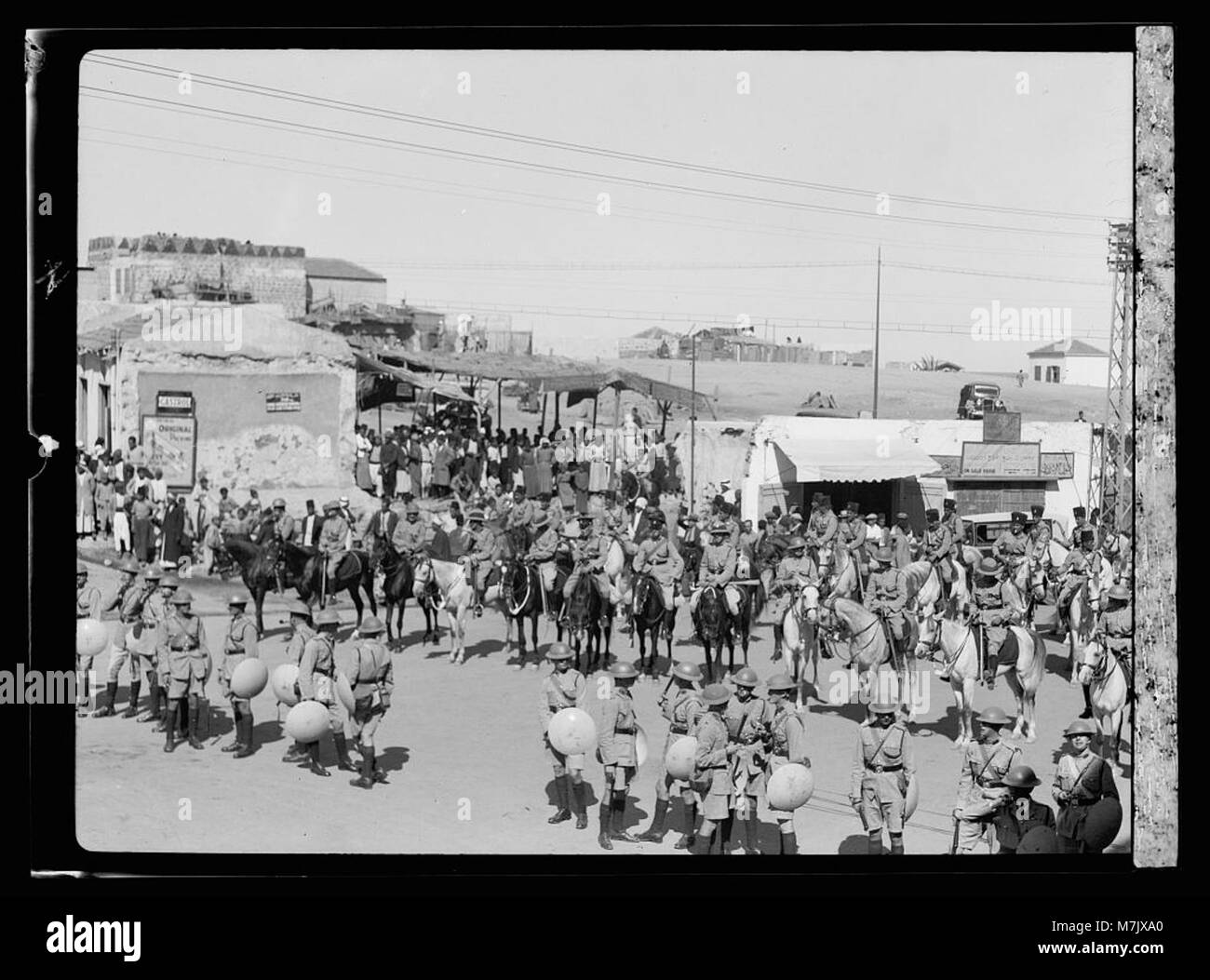 Arab demonstrations on Oct. 13 and 27, 1933. In Jerusalem and Jaffa. Foot and mounted police patrolling Jaffa Square with steel helmets and shields LOC matpc.15787 Stock Photo